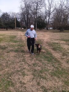 Kimber taking a walk with a volunteer